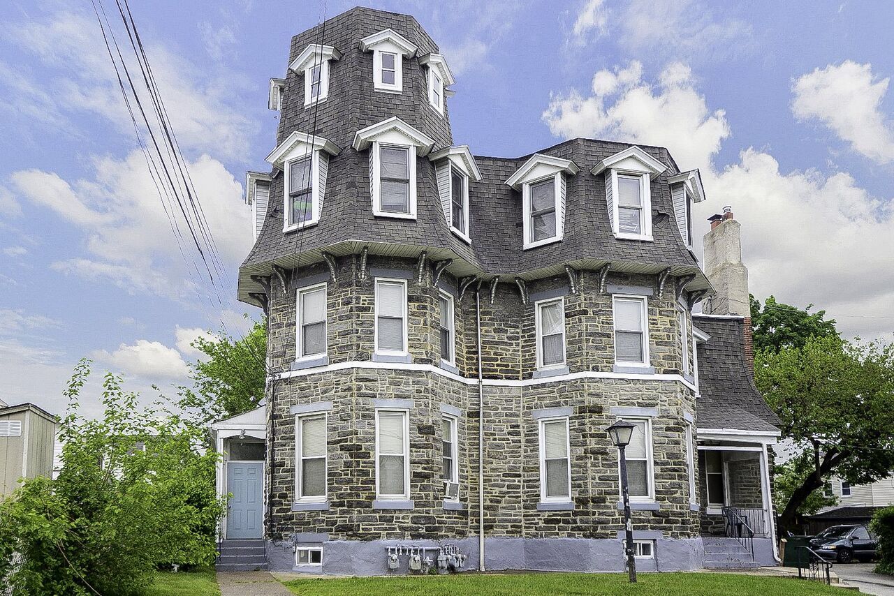 Historic stone twin home on an established street